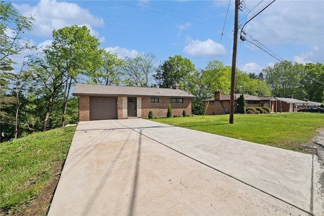 ranch-style home with a garage and a front lawn