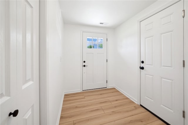 doorway featuring light hardwood / wood-style floors