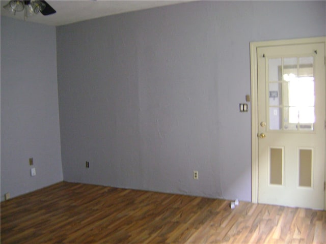 spare room with hardwood / wood-style floors and ceiling fan