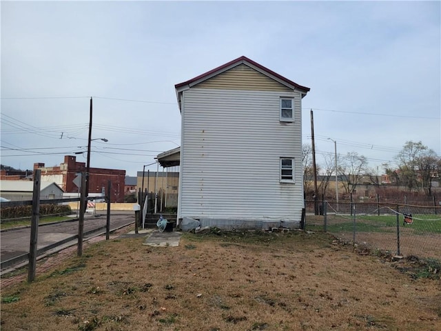 view of home's exterior featuring a yard