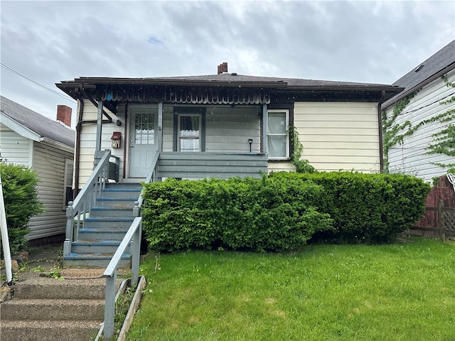 bungalow-style house featuring a front yard and a porch