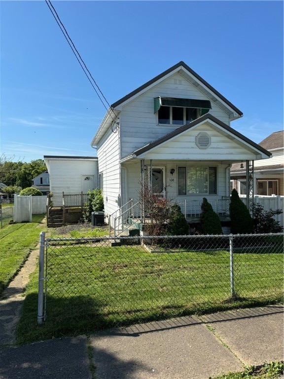 view of front of property with a front lawn, central air condition unit, and a porch