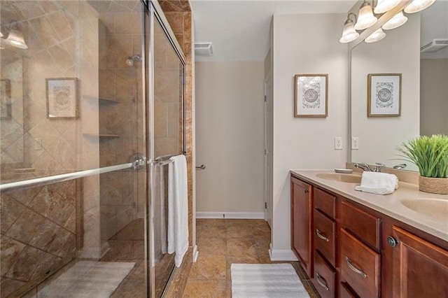 bathroom with walk in shower, tile flooring, double sink, and vanity with extensive cabinet space