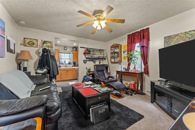 living room with a textured ceiling, ceiling fan, and dark carpet