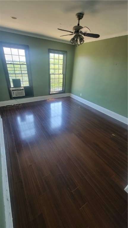 unfurnished room featuring dark hardwood / wood-style floors and ceiling fan