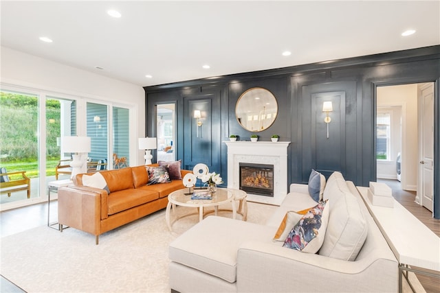 living room with a fireplace and hardwood / wood-style floors