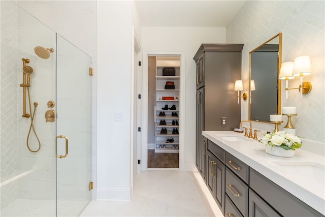 bathroom with double vanity, a shower with door, and hardwood / wood-style floors