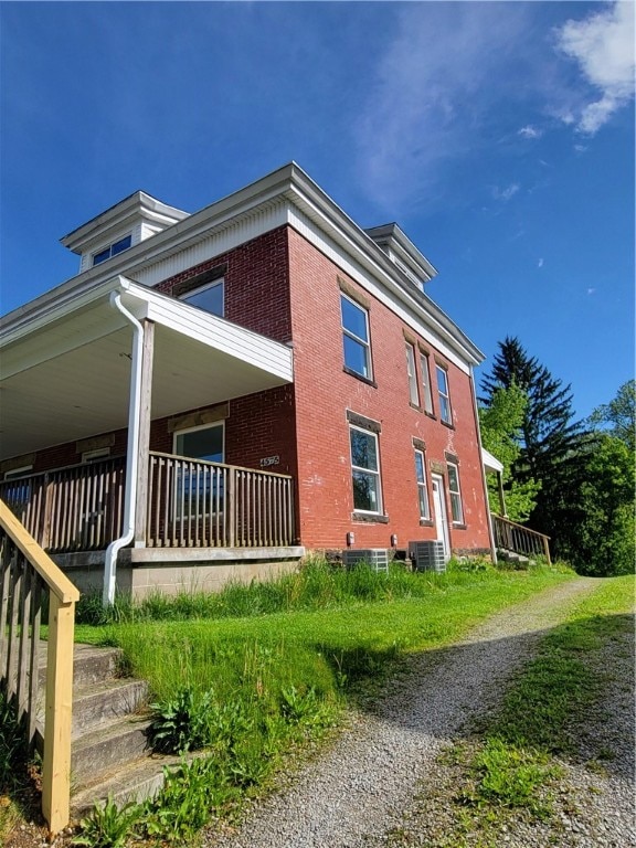 view of property exterior with central AC unit