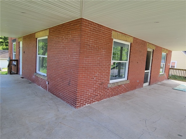 view of property exterior with a porch