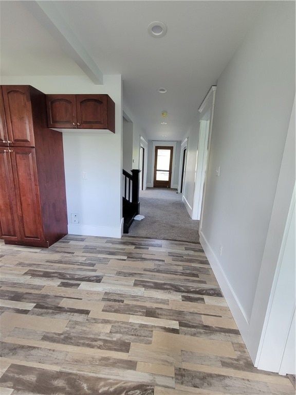 hallway with wood-type flooring