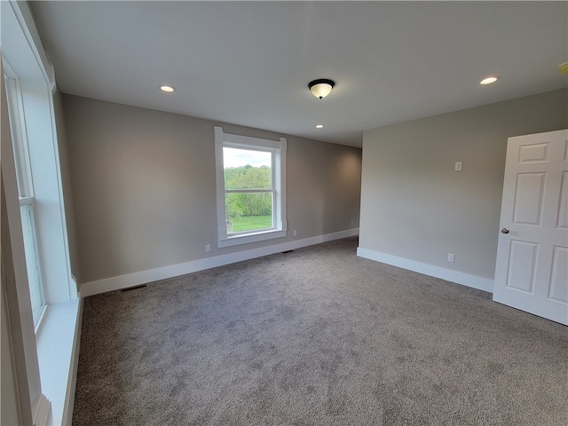 empty room featuring carpet flooring