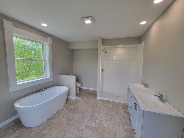 bathroom featuring a tile shower, double sink vanity, toilet, and tile floors