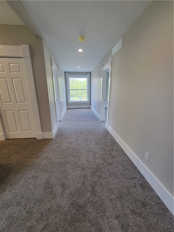 hallway featuring carpet floors