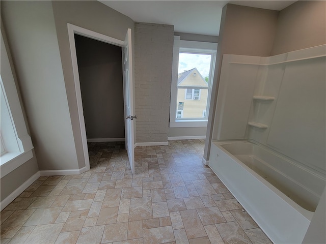 bathroom with bathing tub / shower combination