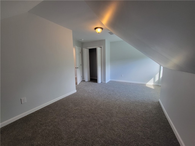 bonus room with carpet and lofted ceiling