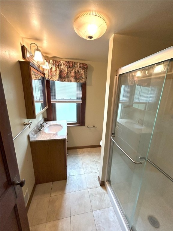 bathroom with walk in shower, vanity, toilet, and tile floors