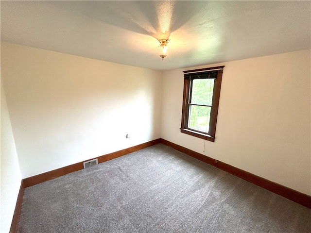 spare room featuring carpet