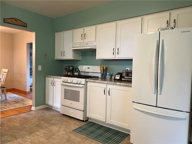 kitchen featuring white cabinets, light hardwood / wood-style floors, and white appliances