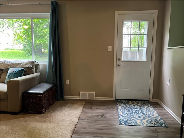 doorway featuring wood-type flooring