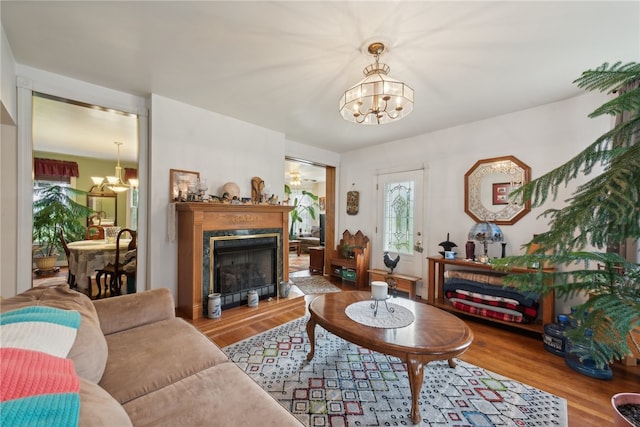 living room featuring hardwood / wood-style flooring and a chandelier