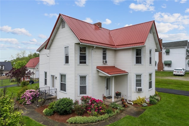 view of front of home with a front lawn