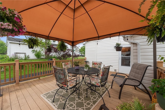 wooden terrace featuring a gazebo