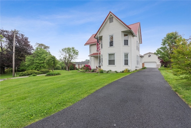 view of front facade with a front lawn and a garage