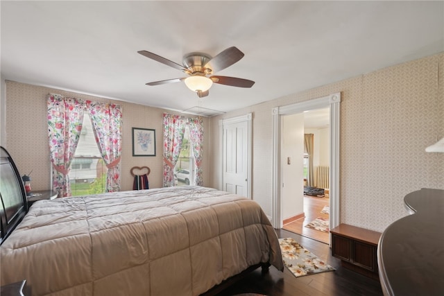 bedroom featuring hardwood / wood-style flooring and ceiling fan