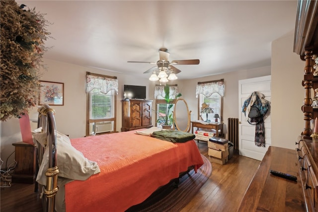 bedroom with hardwood / wood-style flooring and ceiling fan