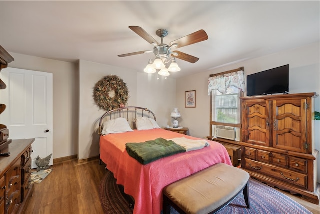 bedroom featuring dark wood-type flooring and ceiling fan