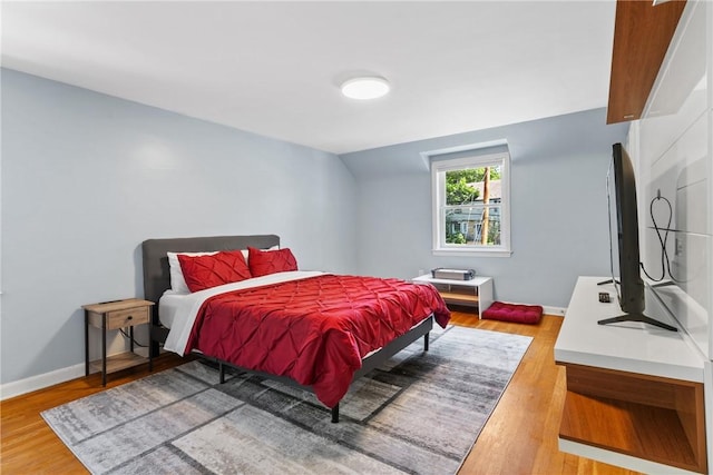 bedroom with wood-type flooring