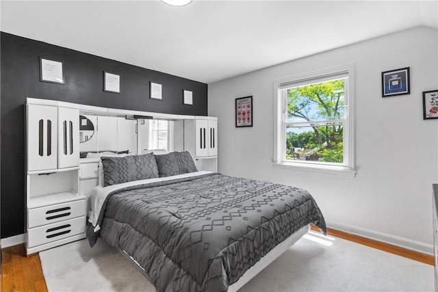 bedroom with hardwood / wood-style flooring