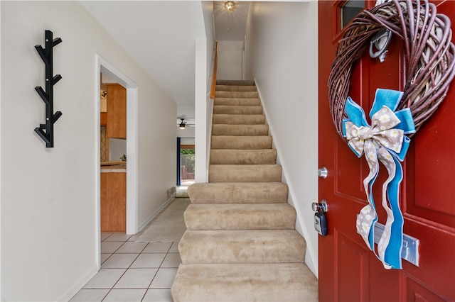 stairs with light tile floors