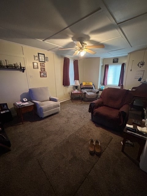 carpeted living room with ceiling fan