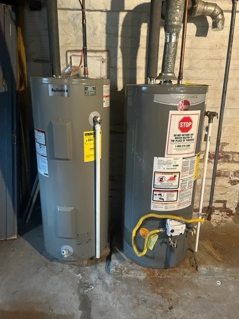 utility room featuring water heater and gas water heater