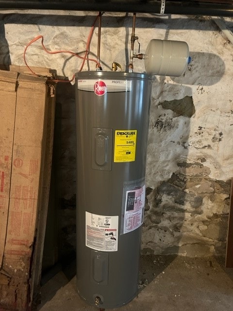 utility room featuring water heater