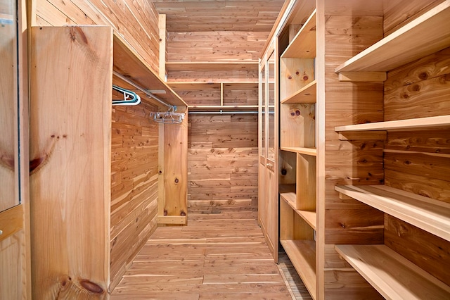 spacious closet featuring light wood-type flooring