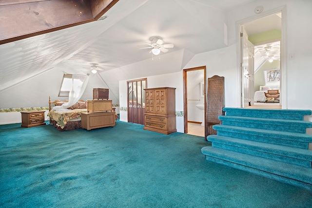 bedroom featuring ensuite bathroom, carpet floors, and ceiling fan