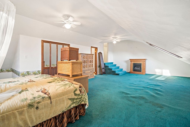 bedroom featuring lofted ceiling, carpet, and ceiling fan