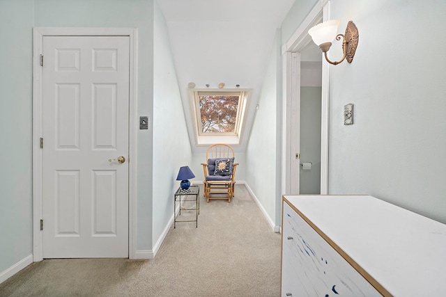 hall with light colored carpet