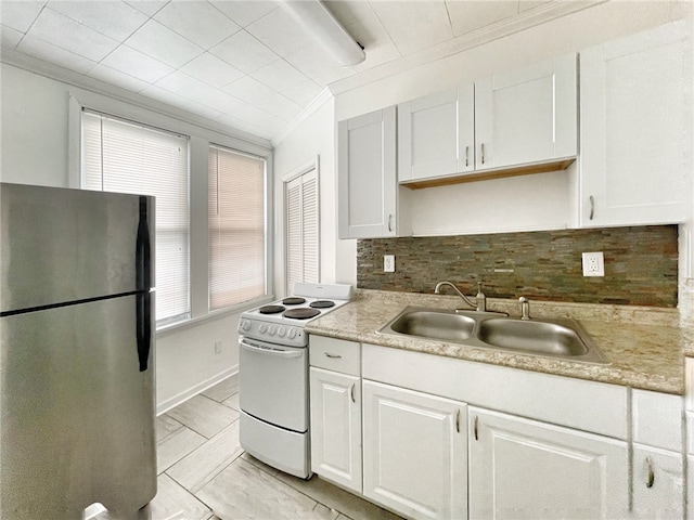 kitchen with white electric range, light tile flooring, sink, stainless steel refrigerator, and ornamental molding