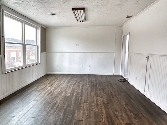 empty room featuring dark hardwood / wood-style floors