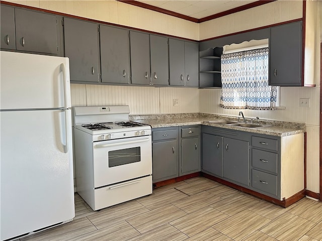 kitchen with light tile flooring, gray cabinetry, crown molding, sink, and white appliances