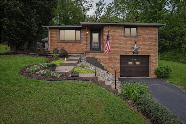 view of front of property with a garage and a front yard