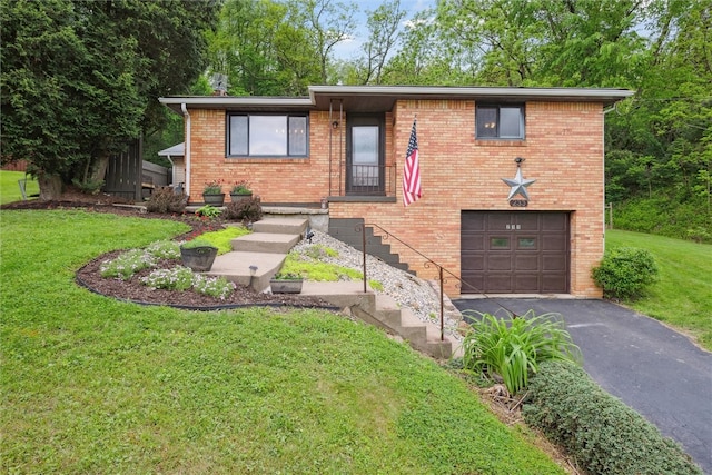 view of front of house with a garage and a front yard