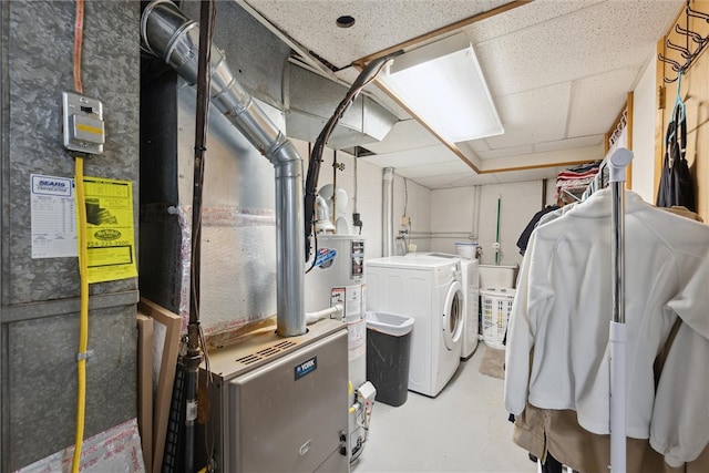 washroom with independent washer and dryer and gas water heater