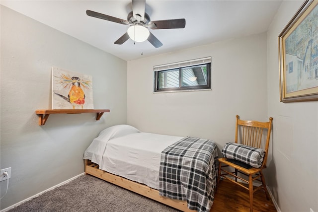 bedroom with ceiling fan and dark hardwood / wood-style flooring