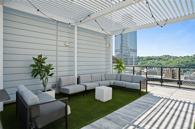 wooden terrace featuring outdoor lounge area