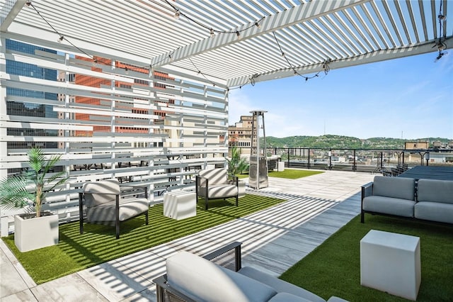 view of patio / terrace with outdoor lounge area and a pergola