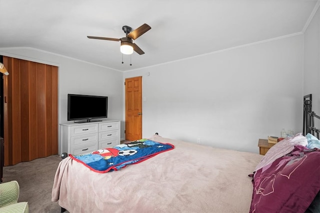 carpeted bedroom with ceiling fan and ornamental molding